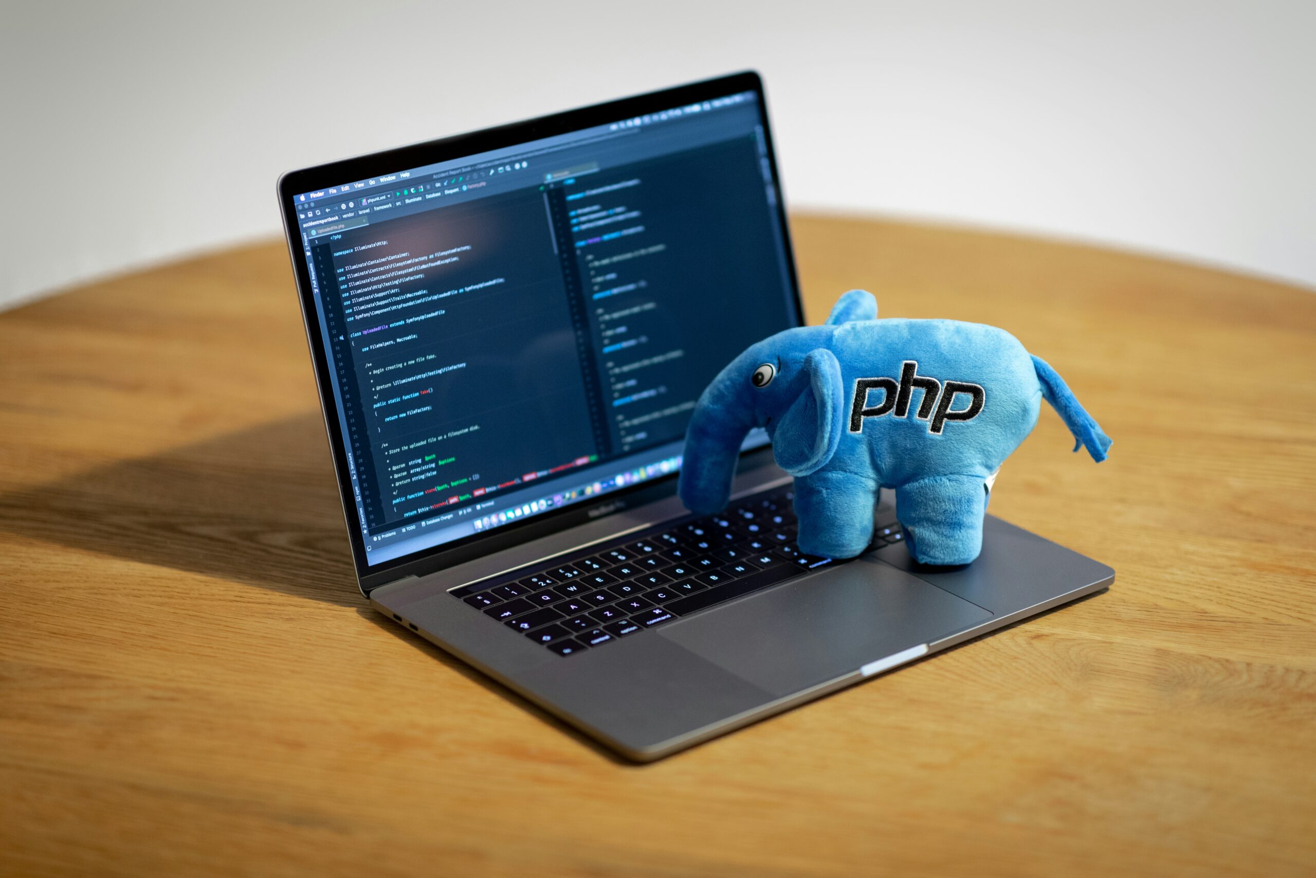 Why C Programming is the Ideal Choice for App Development blue elephant figurine on macbook pro